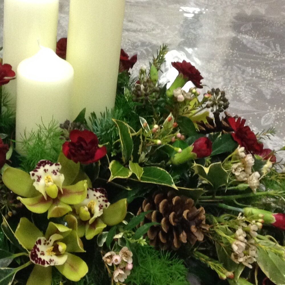 Christmas flowers, Christmas wreath, pine cones, candles, red brown brown