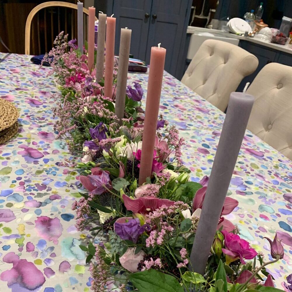 event flowers, candles, pink purple green
