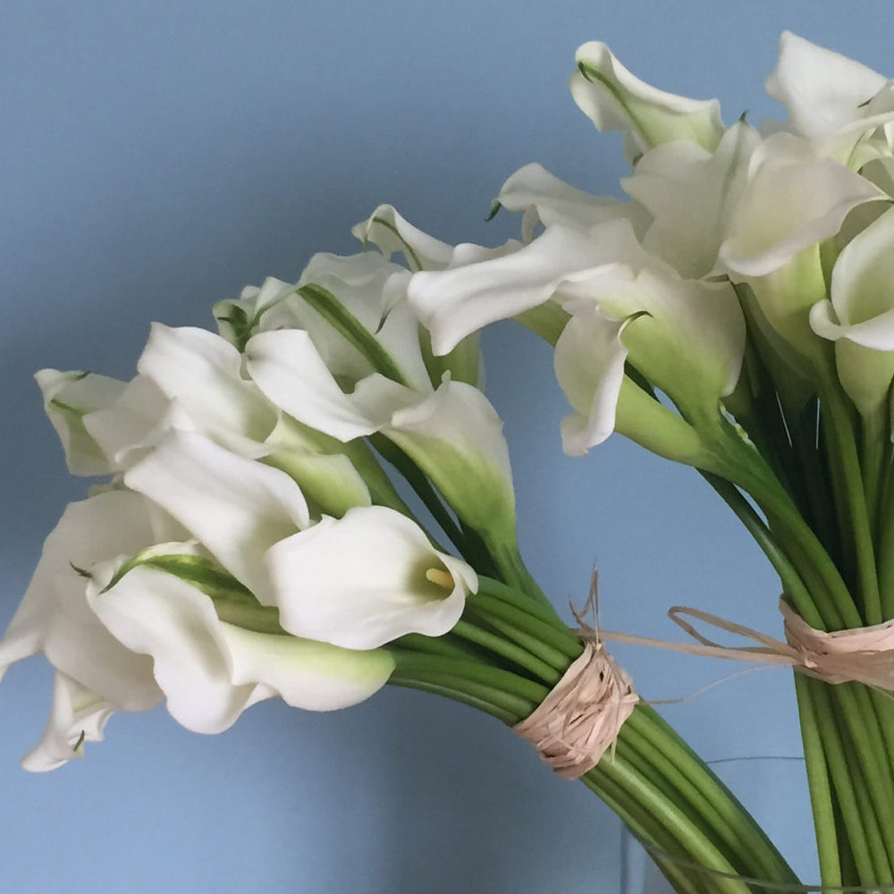 sympathy lilies, funeral flowers, white green