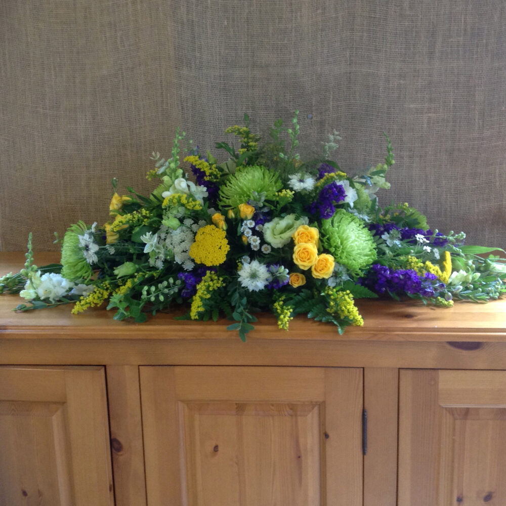 sympathy flowers, funeral, arrangement, roses, yellow green white purple