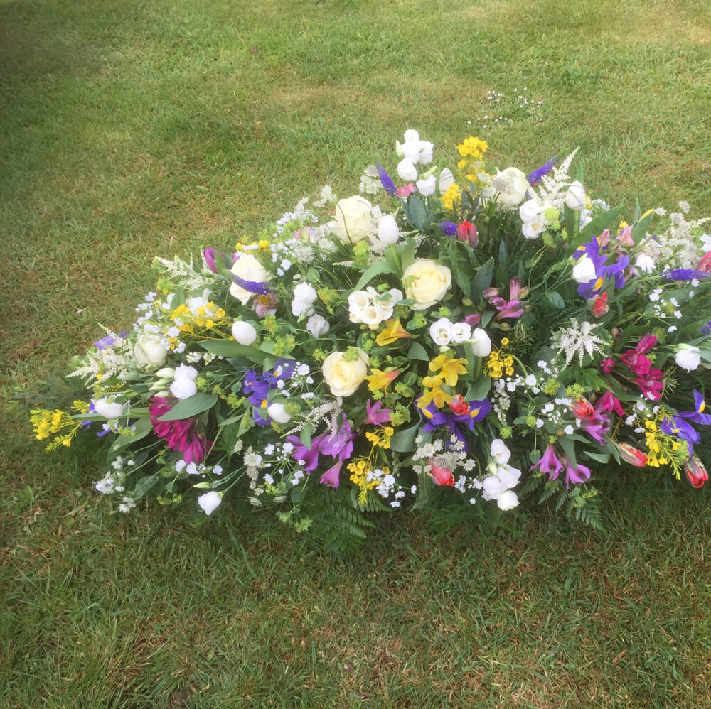 sympathy flowers, funeral, arrangement, white purple yellow pink green