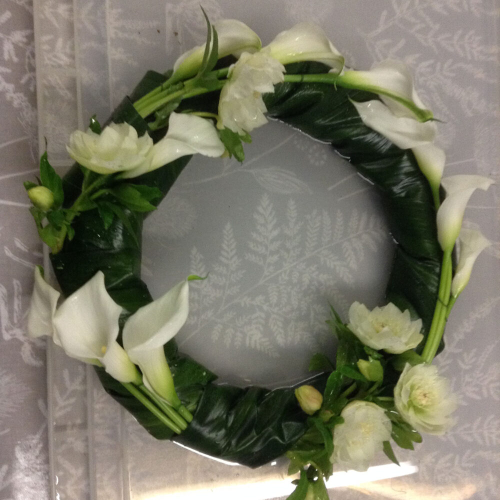 sympathy flowers, funeral, wreath, lillies, white green