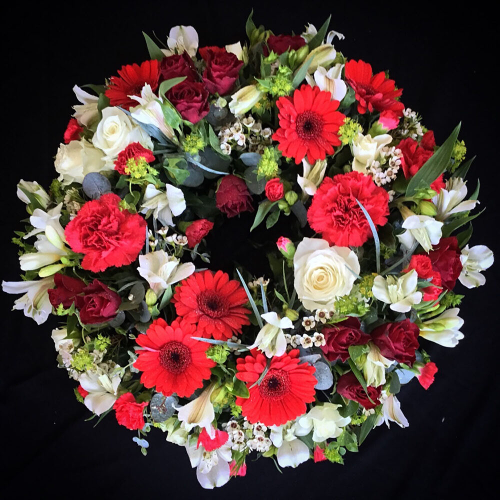 sympathy flowers, funeral, wreath, roses, red white green